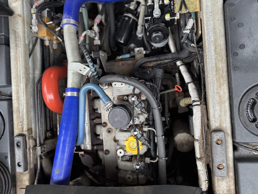 Close up photo of a commercial truck's engine from above.