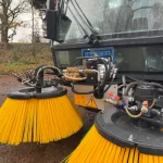 Close-up of the front of a Swingo 200 sweeper.