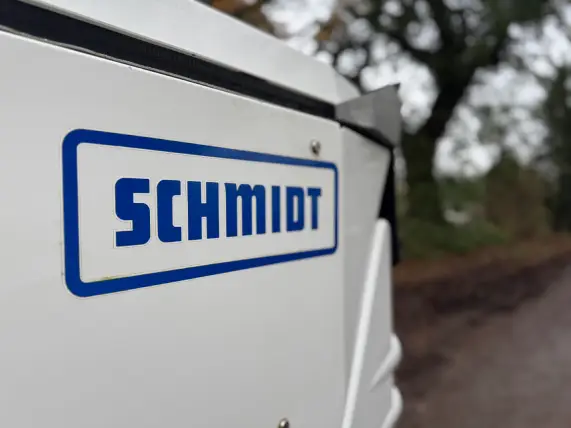 Close-up photo of the Schmidt sweepers logo on the side of a Swingo 200 model.